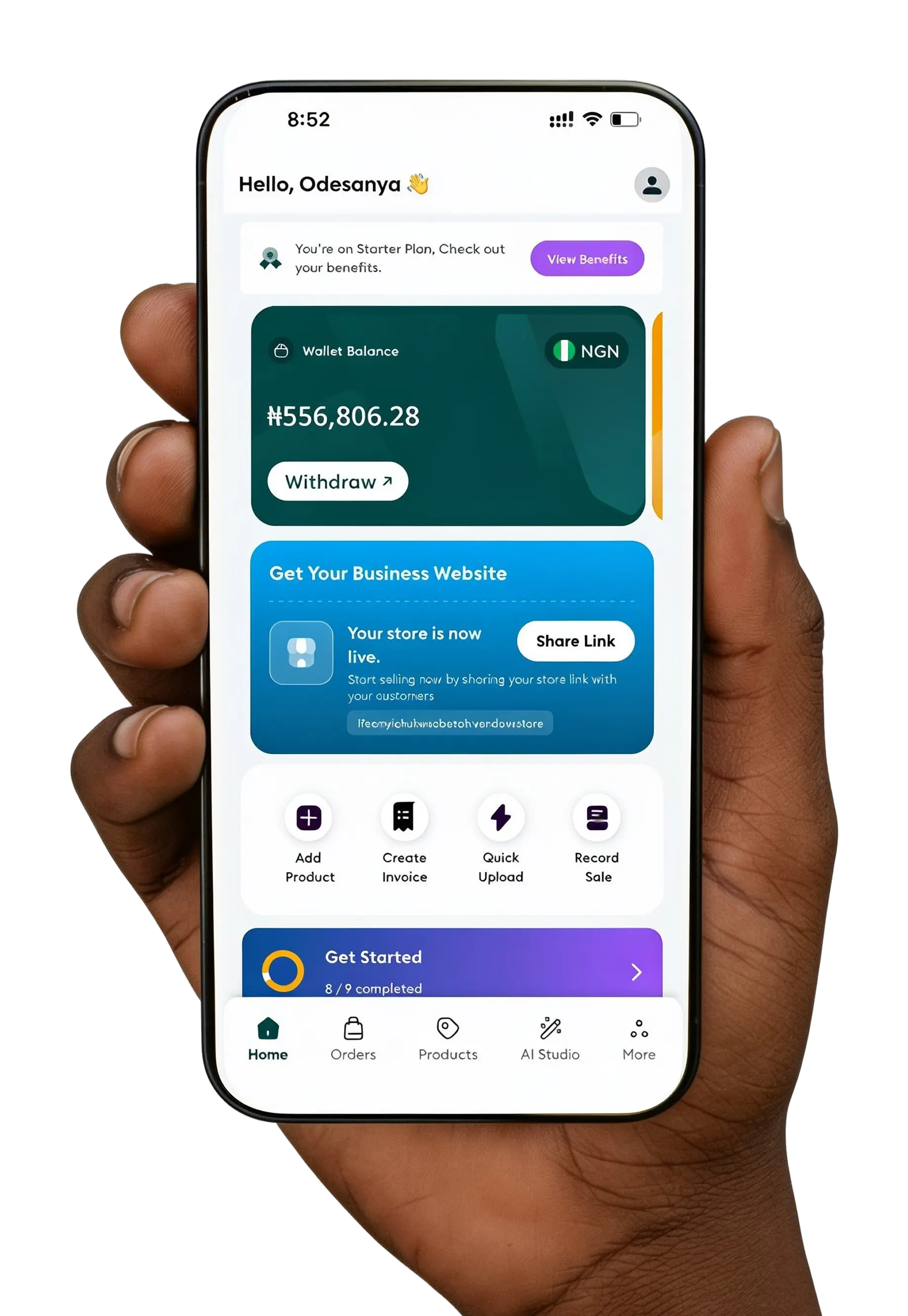 A hand holding a phone showing the Vendaw app dashboard